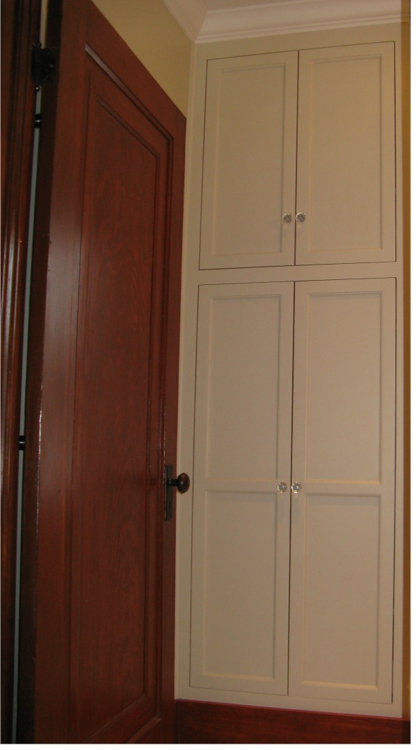 white built in bathroom cabinet