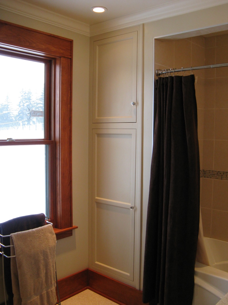 white built in bathroom cabinet